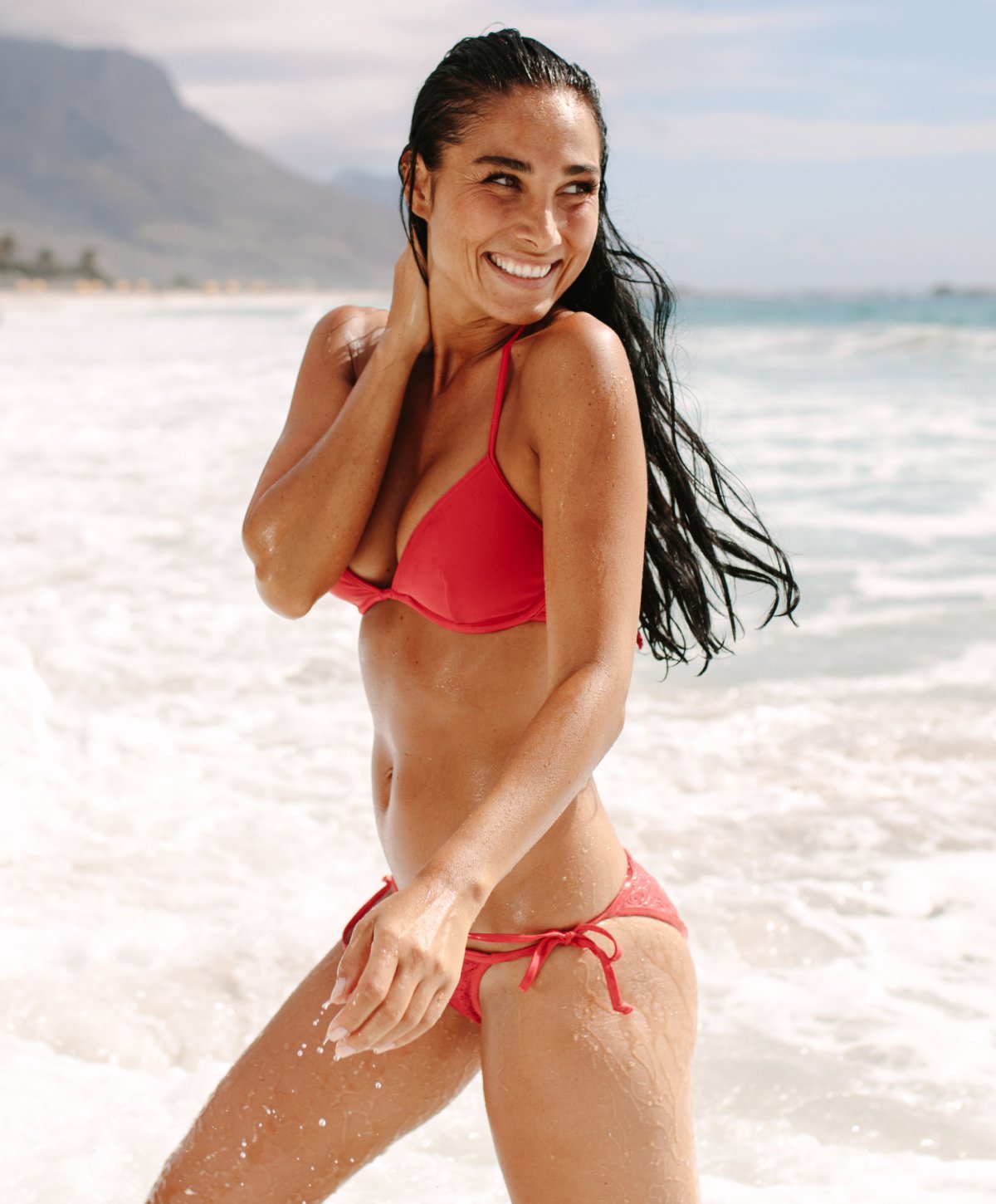Temecula Plastic Surgery model smiling on beach